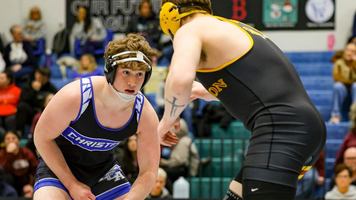 Lexington Christian’s Mac Darland squares up against Harrison County’s Brock Sexton during the 215 division finals at the Boys/Coed Region 6 Wrestling Championships at East Jessamine High School on Saturday.