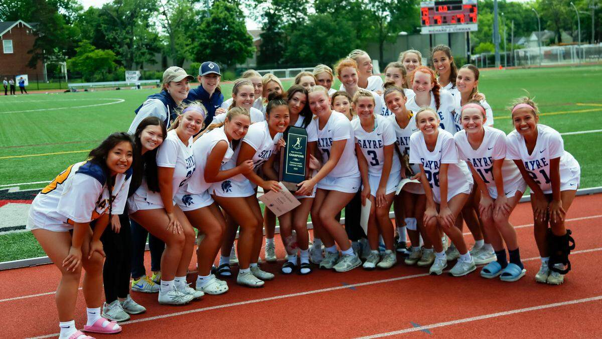 The Sayre Spartans girls lacrosse team posed with their Commonwealth Lacrosse League state championship trophy after defeating Bowling Green 14-3 at Transylvania University’s Pat Deacon Stadium on Saturday.