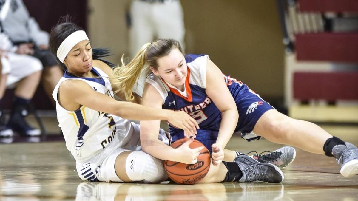 Franklin County’s Princess Stewart (5), left, and Madison Southern’s Ashlyn Clark (5) scrambled for the ball during the opening round of the girls’ 11th Region Tournament on Monday night in Richmond.