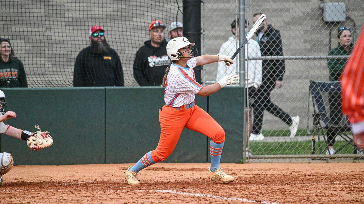 Frederick Douglass’ Riley Baker watches the flight of her home run in the sixth inning of the Broncos’ 8-2 win against Scott County in the 42nd District Tournament championship game at Frederick Douglass on Wednesday.