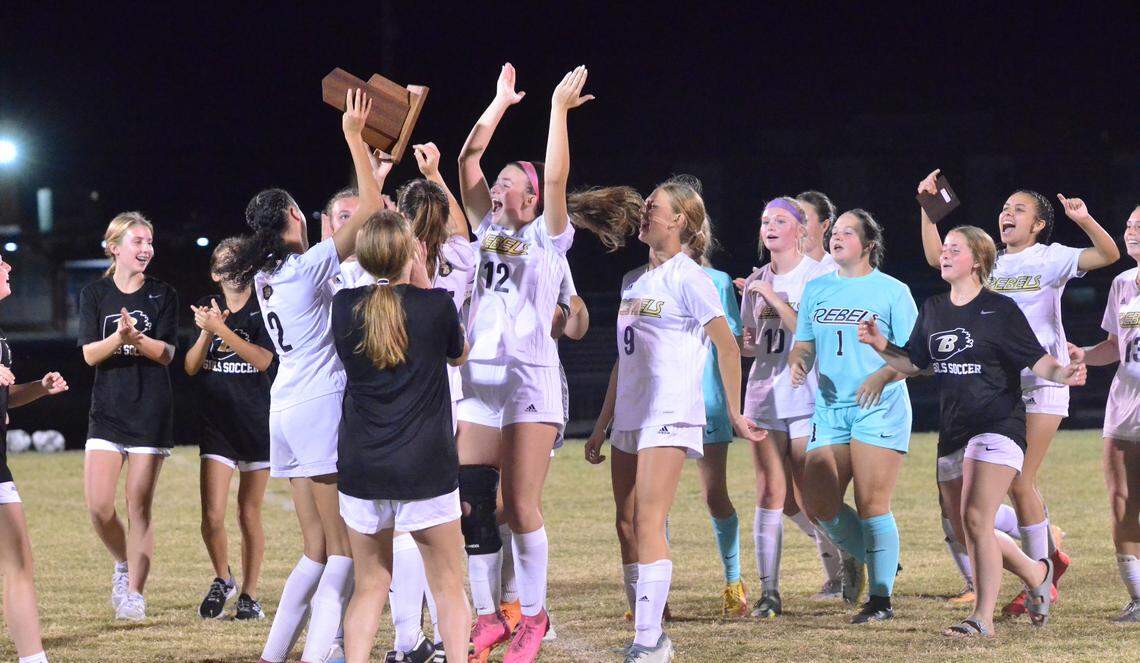 Boyle County’s girls soccer team celebrated with their 12th Region tournament championship trophy after defeating defending champion West Jessamine in Nicholasville on Oct. 14.