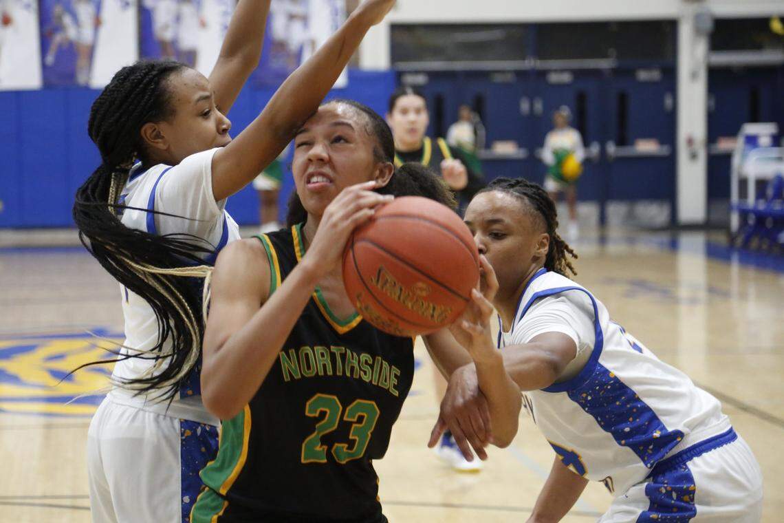 Bryan Station’s Kailyn Gentry is double-teamed in the post by Henry Clay’s Tamia Waide and Timarri Miller during their game on Friday.