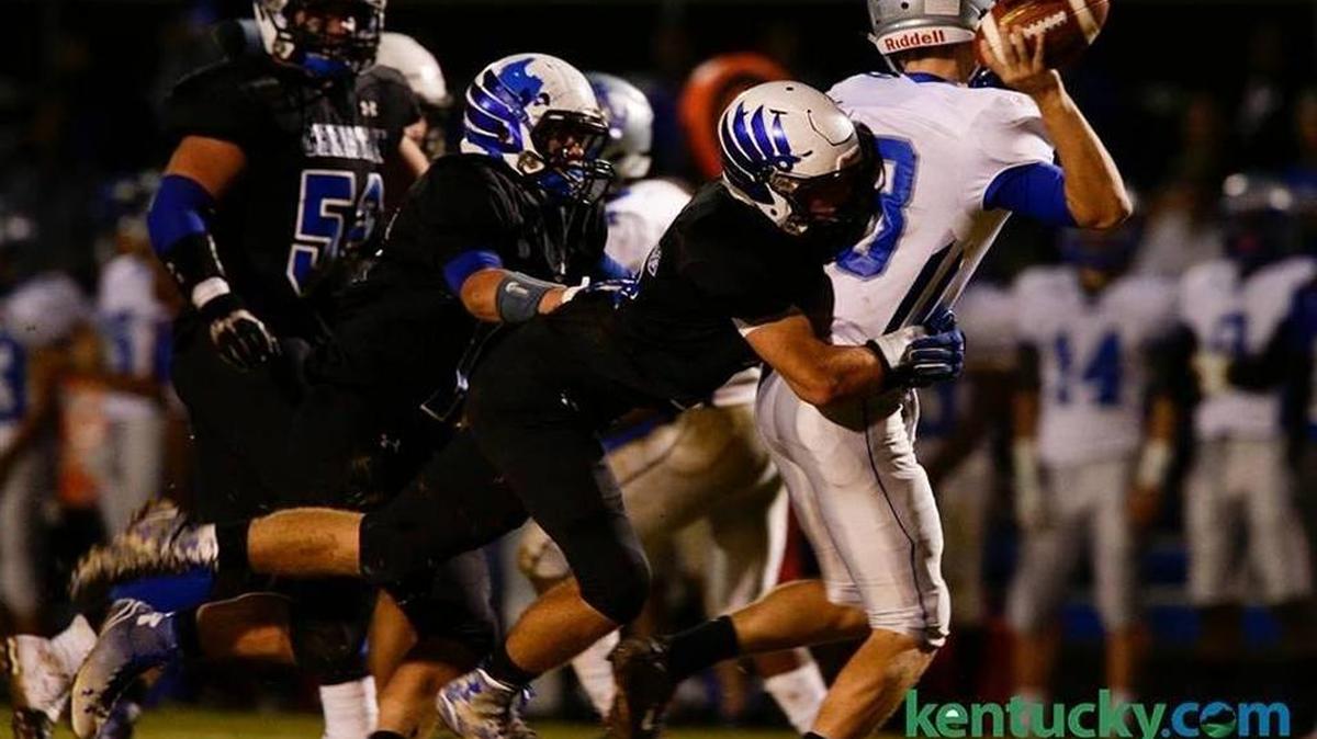 LCA's Clay Elliott, 17 sacked Danville quarterback Zack Dampier, 18, as Danville played LCA on Friday October 23, 2015 in Lexington, Ky.