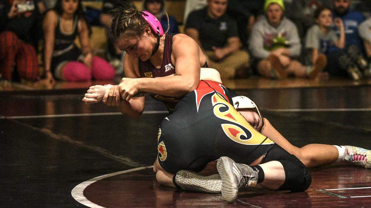 Tates Creek’s Trinity Gossler, left, defeated Perry County Central’s Caitlin Ritchie in the championship match of the 165 class at the Kentucky Wrestling Coaches Association’s Girls’ Wrestling State Championships on Saturday at Tates Creek High School.