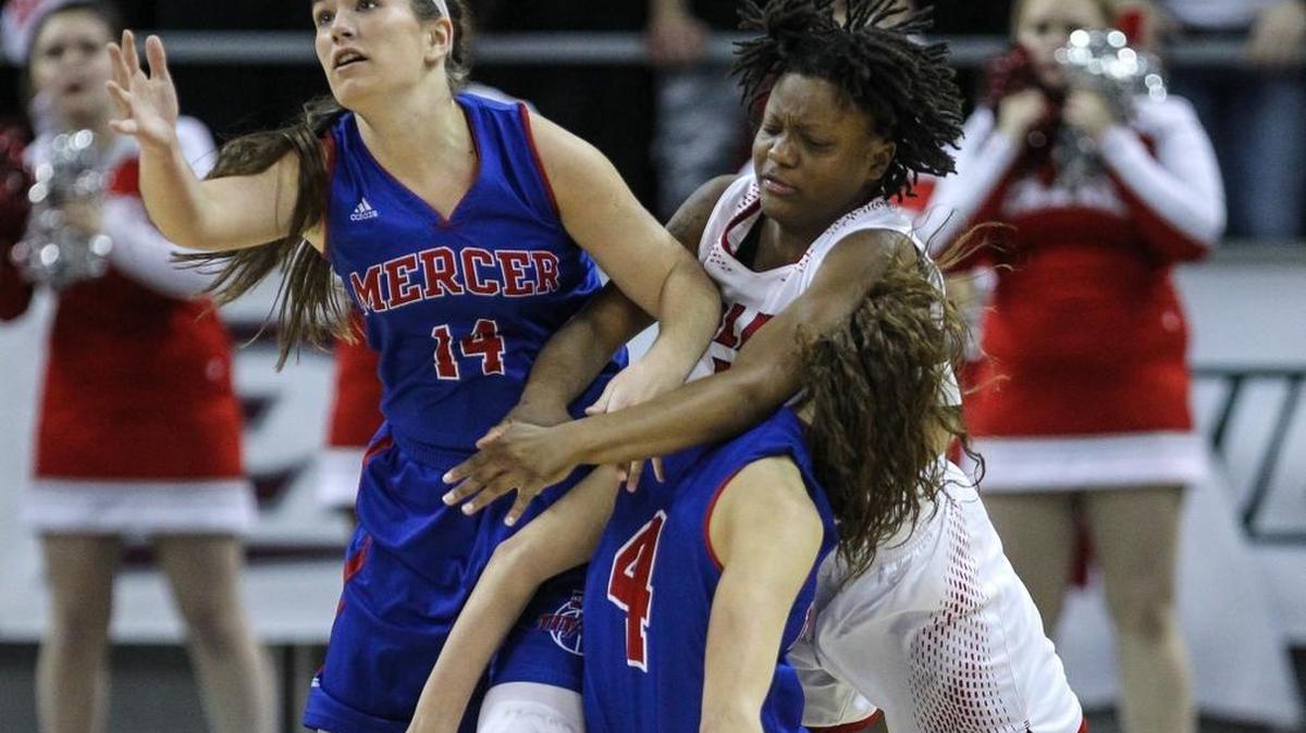 Mercer County's Madeline Bartley eyes a turnover after Holmes' Kamari Graham lost the ball while crashing into Seygan Robins during the second half of their game in the 2016 St. Elizabeth Healthcare/KHSAA Girls' Sweet 16 State Tournament, Friday, March 11, 2016.