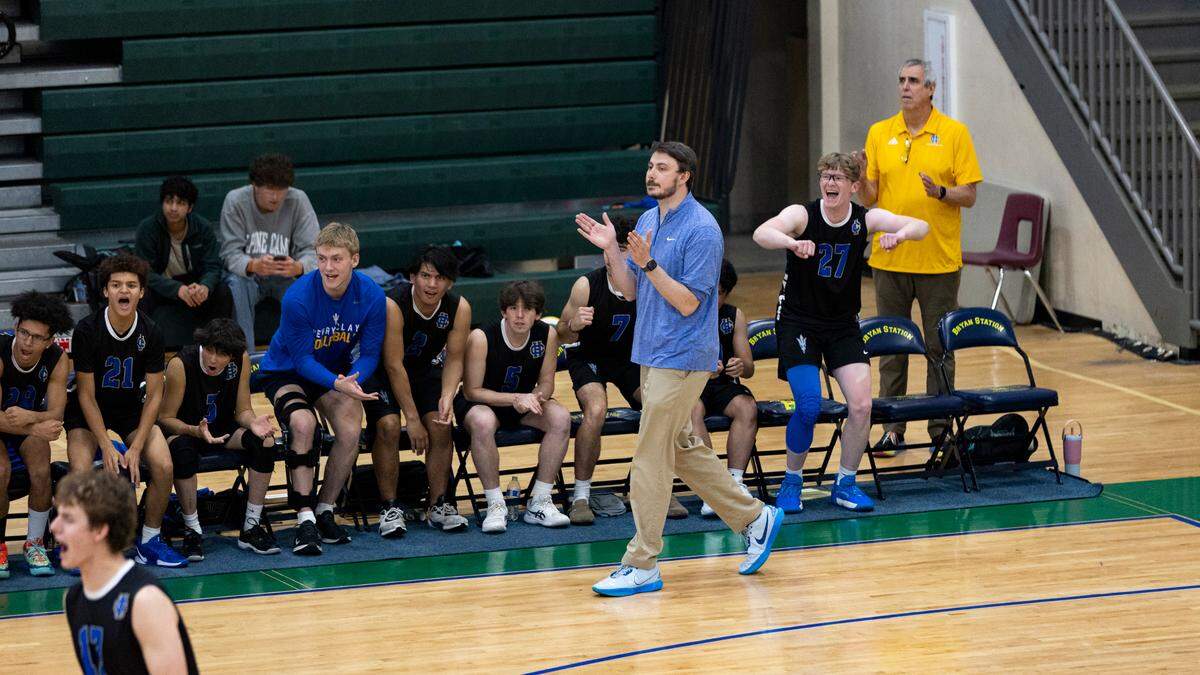 Henry Clay boys volleyball coach Luke Grupe applauded a point in the Blue Devils’ region championship win against Lafayette at Bryan Station High School on Monday. Henry Clay topped Lafayette again in the state quarterfinals four days later.