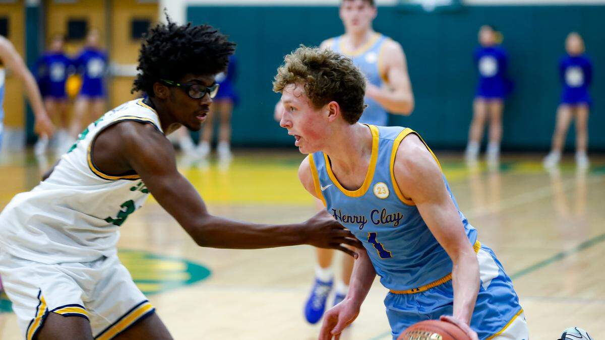 Bryan Station’s Taeshawn Adams, left, checked Henry Clay’s Jackson Stephan on the left wing during the Defenders’ 55-54 win over Henry Clay at Bryan Station High School on Friday.