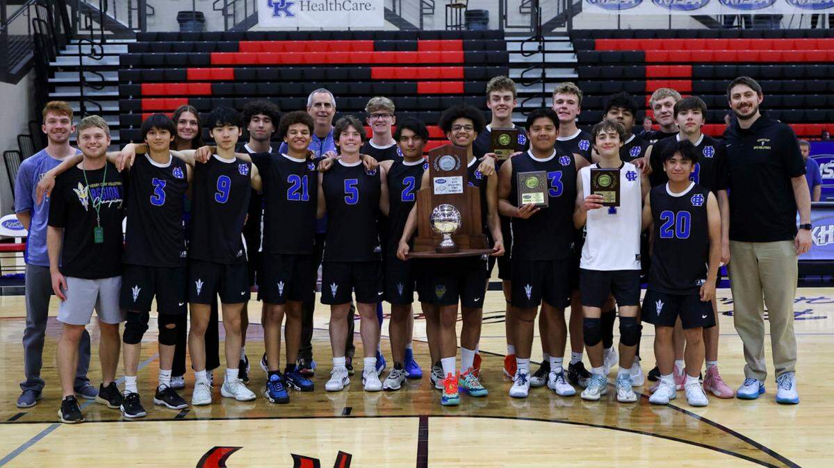 Henry Clay’s boys volleyball team poses with the runner-up trophy after its 3-0 loss to St. Xavier in the first KHSAA Boys State Volleyball Tournament championship game at GRC Arena in Winchester on Tuesday.