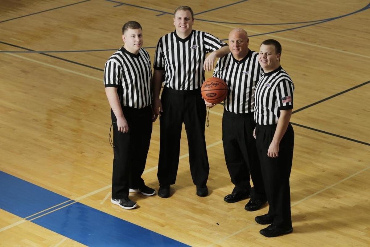 Kenny Gant, second from right, and sons Haydon, left, Marshall, second from left and Robert, posed for a photo at Lexington Christian Academy last January. All three of Kenny’s sons have become referees.