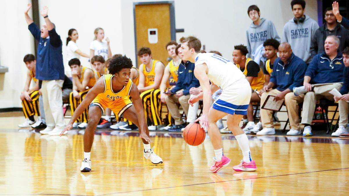 Sayre’s Brock Coffman, left, squared up against Lexington Christian’s Saxton Howard during the Spartans’ 55-41 win over the Eagles in the boys 11th Region All “A” Classic tournament at The Frankfort Christian Academy in Frankfort on Sunday.