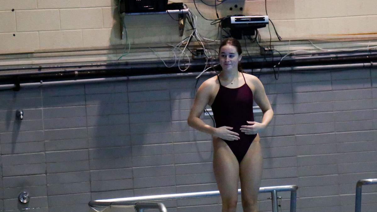 Cooper’s Peytton Moore awaited the go-ahead as she prepared to execute one of her dives during the KHSAA Girls State Diving Championships at the University of Kentucky’s Lancaster Aquatic Center on Thursday. Moore won the state title in the 1-meter springboard event.
