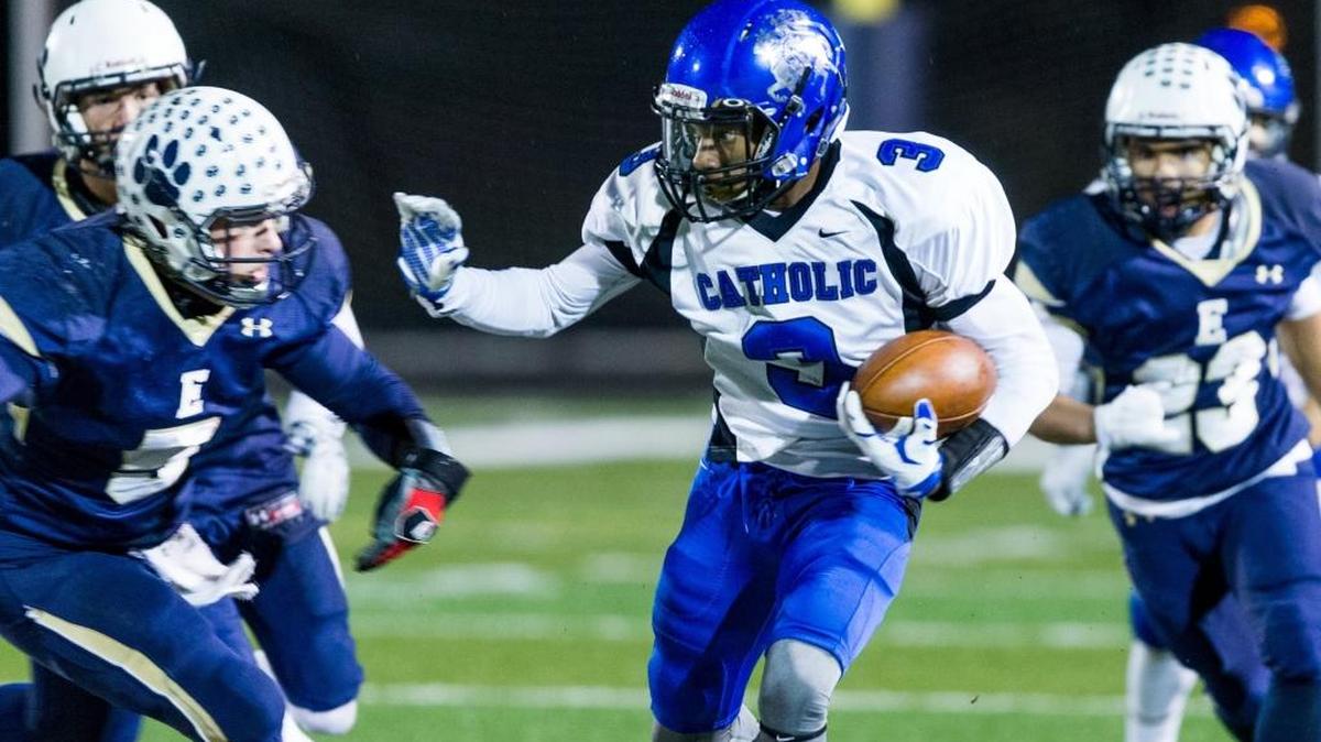 Lexington Catholic J.J. Ogbogu pushed up the field for extra yardage in the first half against Elizabethtown on Nov. 27, 2015.