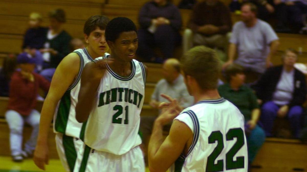 File photo: Kentucky School for the Deaf basketball players Sekoe White (21) and Austin Bradford (22) communicated via sign language as the Kentucky School for the Deaf played against the Tennessee School for the Deaf in Danville, Ky., on Dec. 14, 2000.