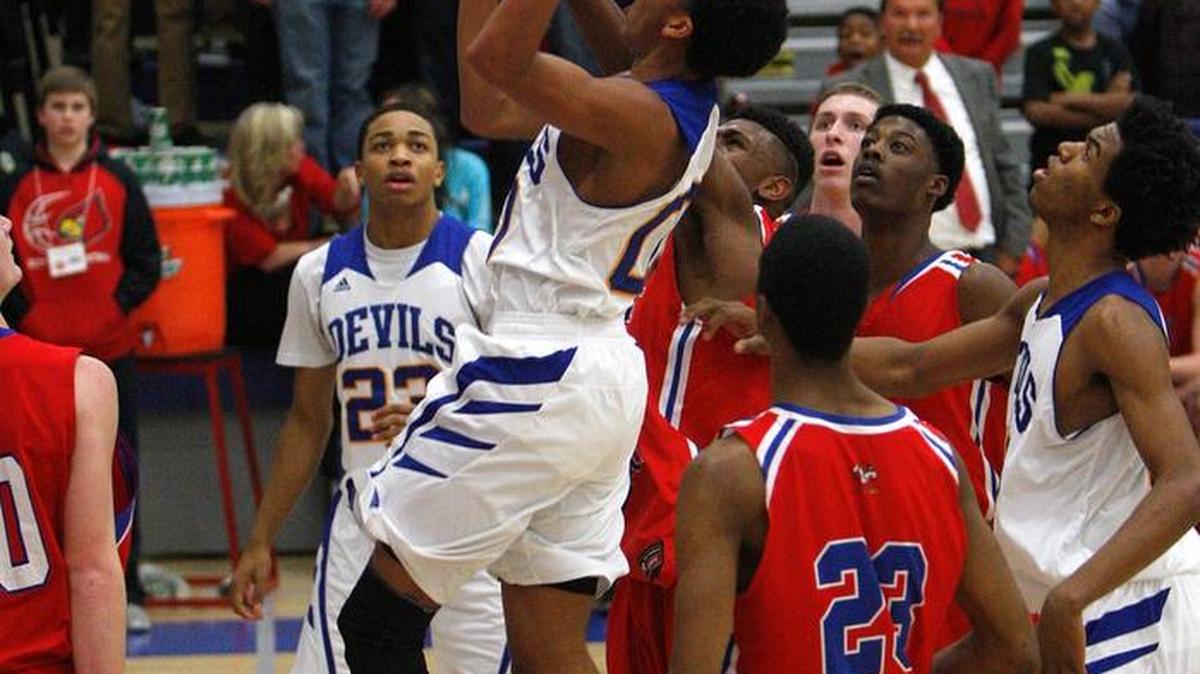 Henry Clay's Isaiah “Pun” Tisdale shoots against Scott Co. in the semifinals of the 42nd district basketball tournament in the Al Prewitt Gymnasium at Henry Clay high school in Lexington, Ky., February 25, 2015.