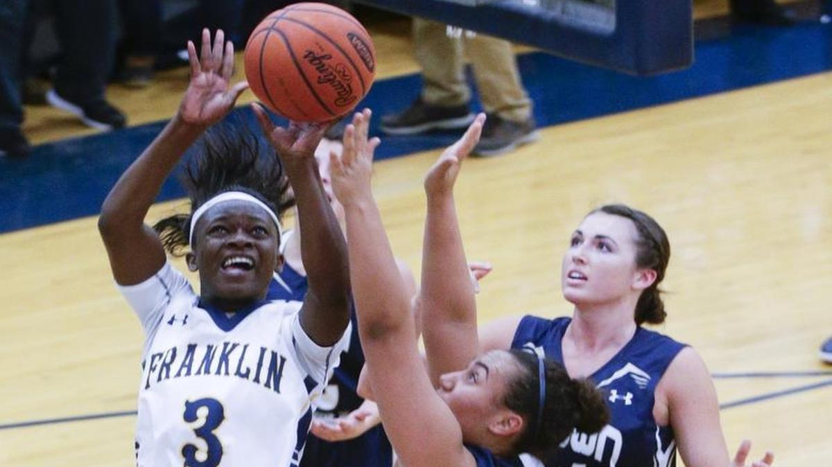 Franklin County’s Malaka Frank put in two of her 14 points as Franklin County defeated Elizabethtown 56-52 on Feb. 12 in Frankfort.