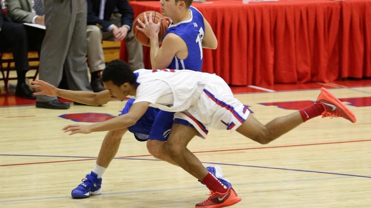 Lafayette's T.J. Downey, 2 , made a diving try at a steal against LCA's Trevors Hill, 10, as No. 5 Lafayette defeated Lexington Christian 67-60 on Friday January 15, 2016 in Lexington, Ky.