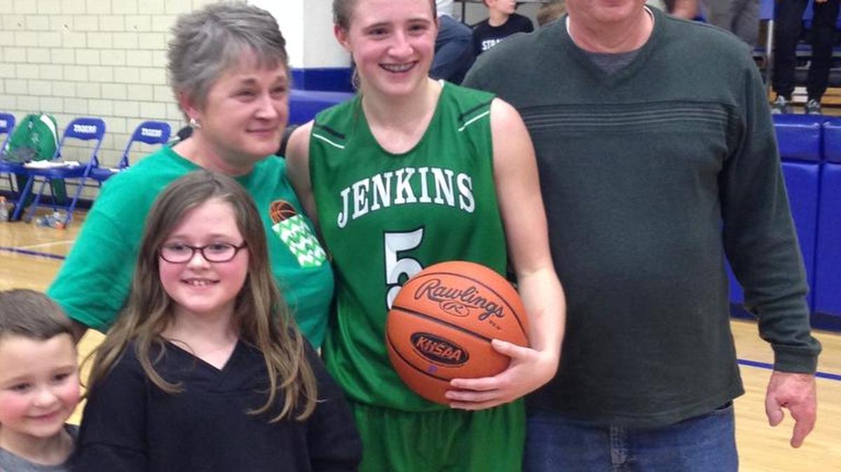 Whitney Creech (5) posed with her mom, Janice, and dad, Dewight, after breaking the all-time scoring record in an overtime win against Paintsville on Tuesday night.