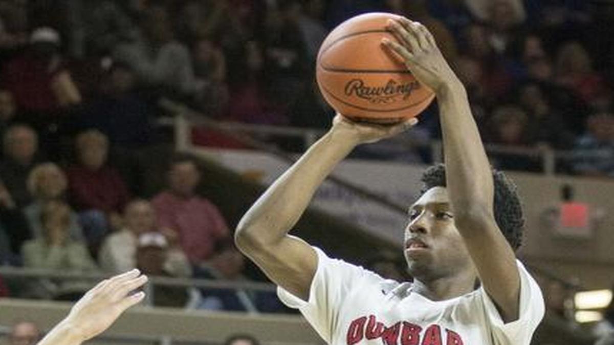 Dunbar's Taveion Hollingsworth (11) shoots over Henry Clay's Jordan Houston (44), during the semifinals of the boys 11th Region tournament, Saturday, March 5, 2016, at EKU's McBrayer Arena in Richmond.