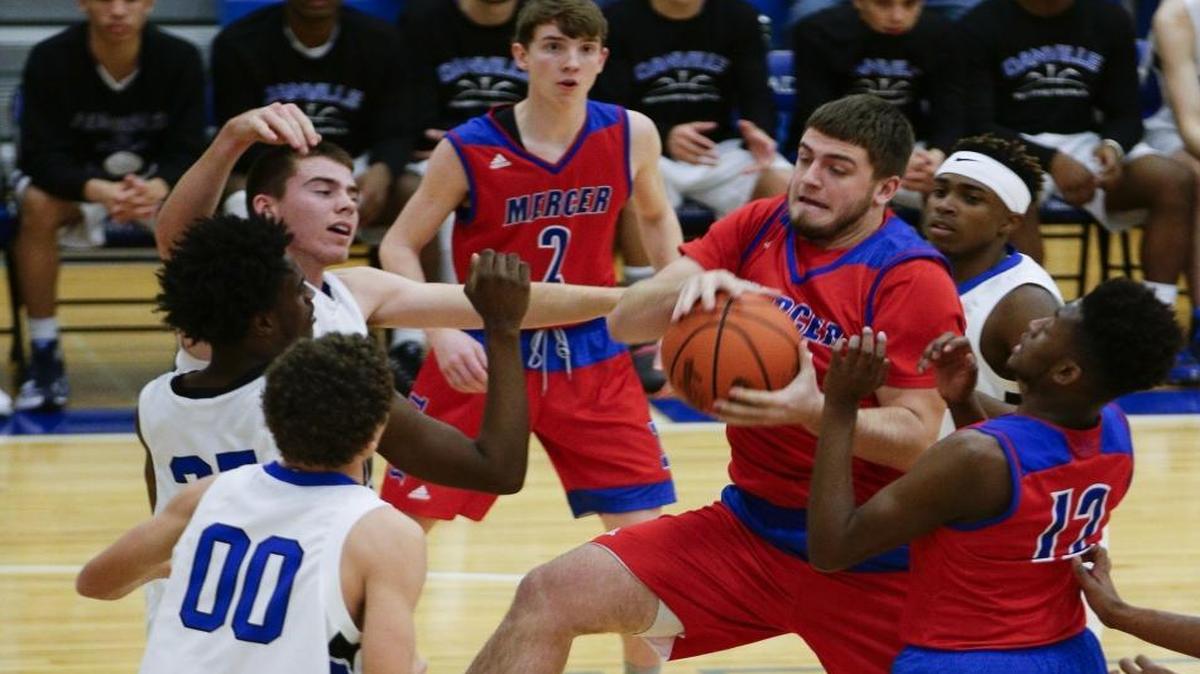 Mercer County’s Drew Davis grabbed a rebound in traffic during a 78-56 win against Danville on Jan. 5.