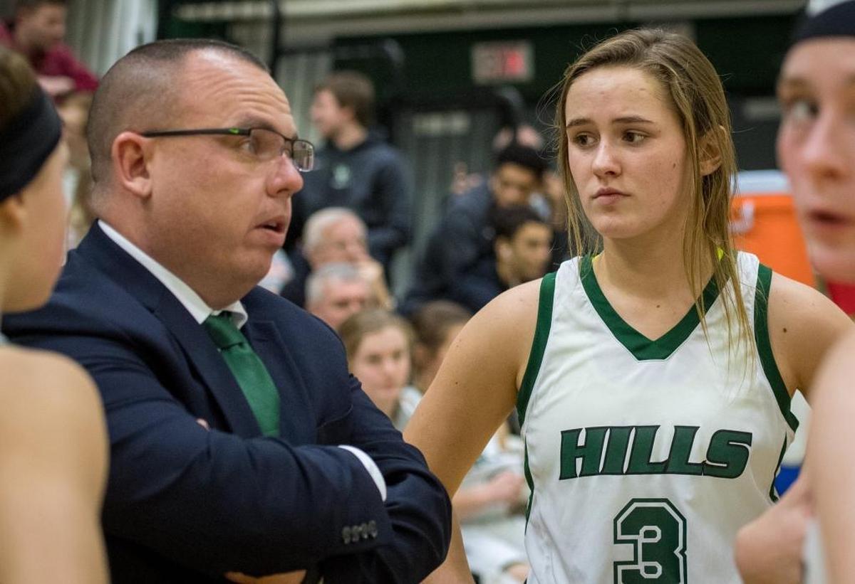 Brandon Muravchick, left, talks to Montana Muravchick and the rest of the Western Hills Lady Wolverines during their game against the Franklin County Lady Flyers at Western Hills High School in Frankfort, Kentucky an January 5, 2018.