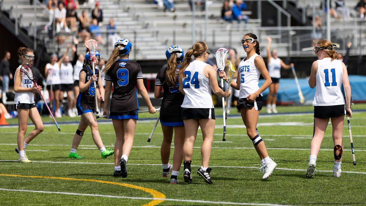 Lexington Catholic’s Poppy Karthikeyan (45) celebrates a goal scored against Lexington Christian by teammate Christy Cervone (24).