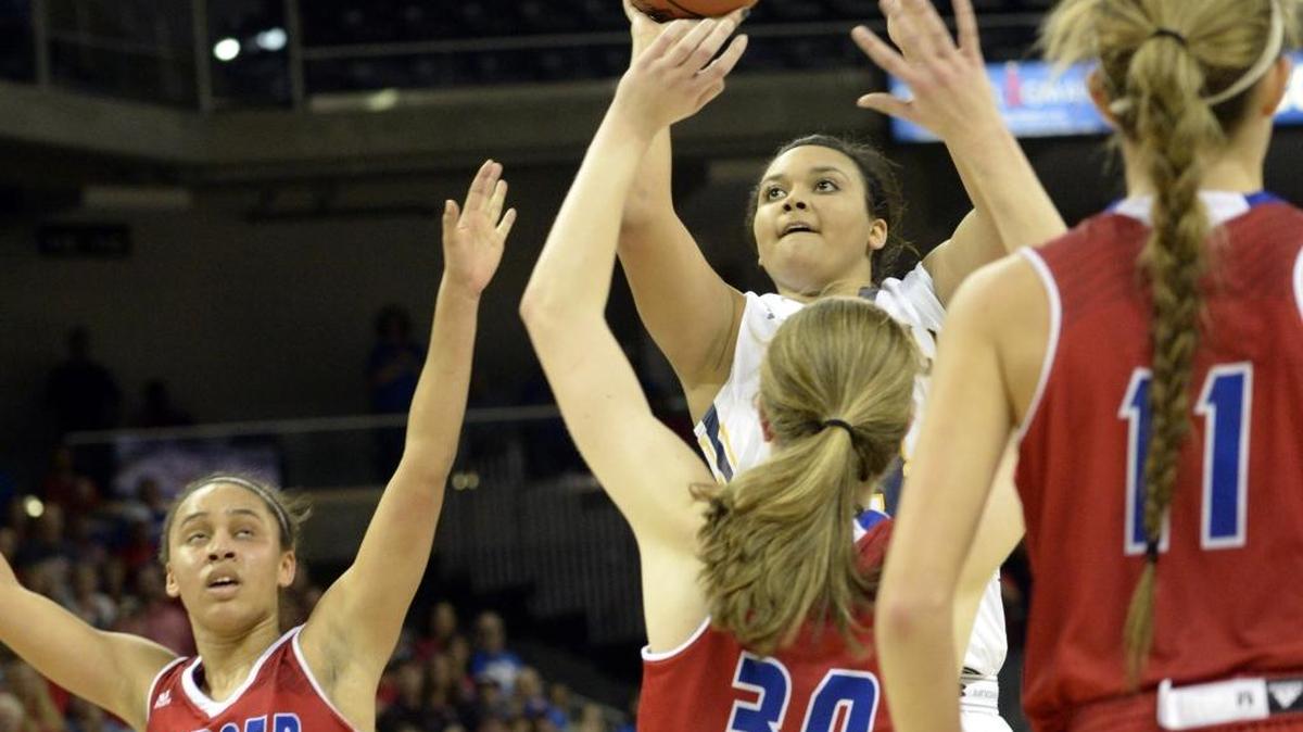 Franklin County’s Dasia Kilbourne shoots over the Mercer County defense Saturday, March 12, 2016, during a KHSAA Girls' Sweet 16 basketball semifinal in Newport, Ky.