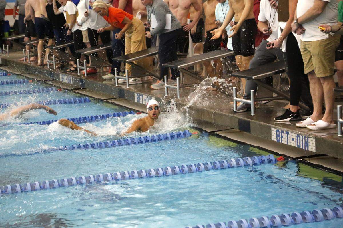 Paul Laurence Dunbar’s Seneca Oddo looks up at the timer after touching the wall on the last leg of one of his four races during the Region 8 Swimming Championships at Stivers Aquatic Center in Barbourville on Saturday.