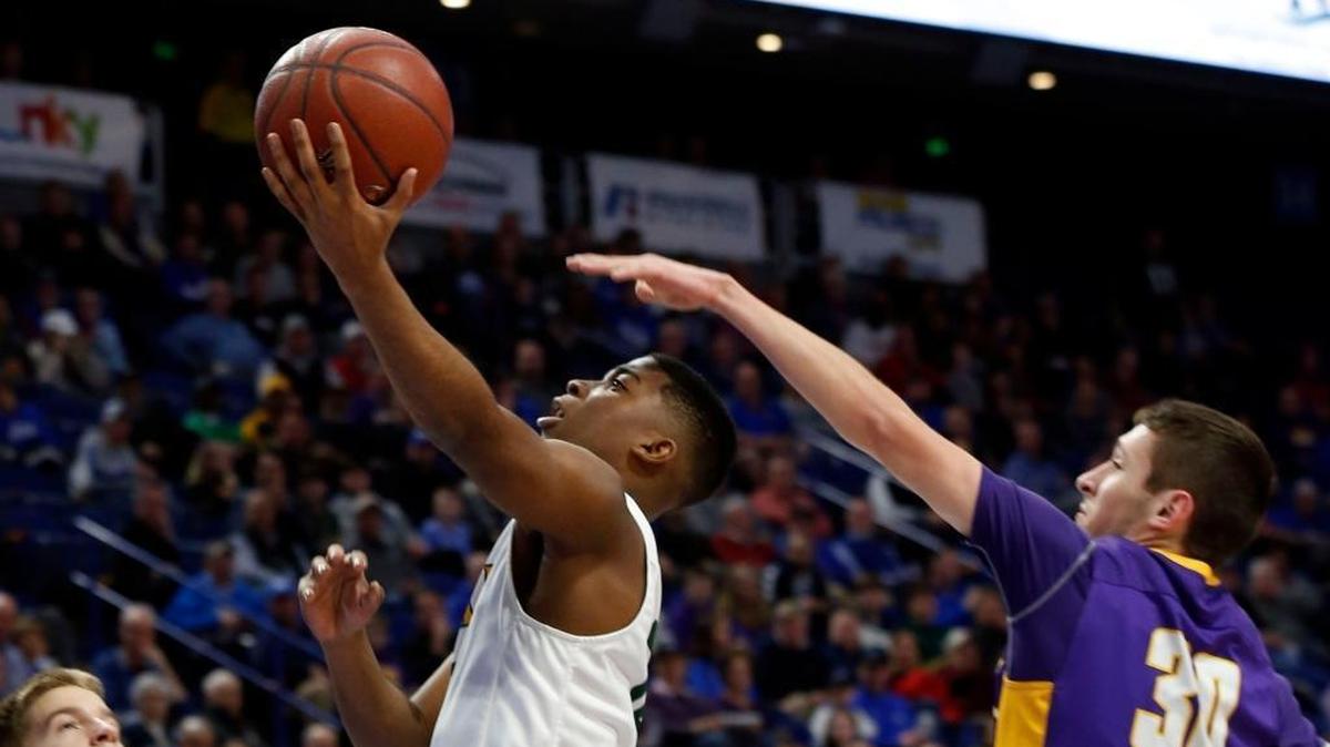 University Heights guard KyKy Tandy (15) scored in front of Campbell County forward Jesse Russell (30) during last season’s Sweet Sixteen in Rupp Arena.