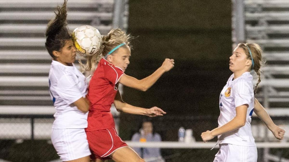 Henry Clay’s Alyssa Vance, left, and Paul Laurence Dunbar’s Audrey Rawls battled for the ball during their teams’ 11th Region Tournament matchup at Woodford County on Monday night in Versailles. Henry Clay prevailed 2-1. Go to Kentucky.com for a report on the game.