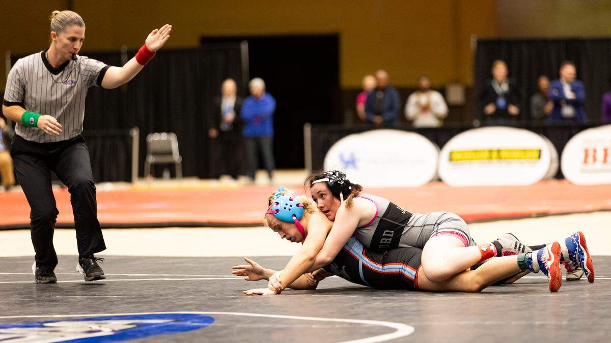 Woodford County’s Lacey Gilbert, held down Union County’s Brailey Jackson during the 120 finals of the 2025 KHSAA Girls State Wrestling Championships at Alltech Arena on Thursday.