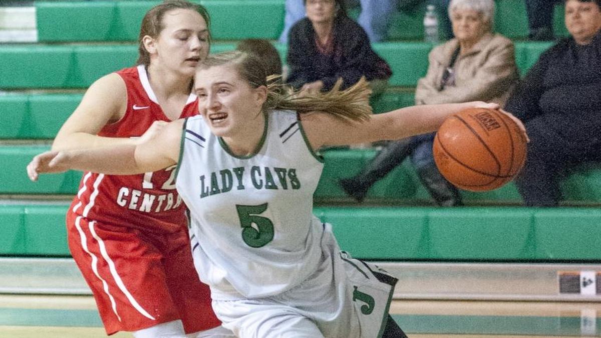 Jenkins High School senior Whitney Creech drives past Perry Central’s Allie Sizemore during a game Monday, December 14, 2015 in Jenkins, Ky.
