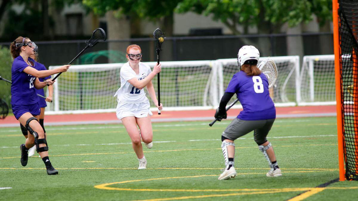 Sayre’s Avery Luring, center, looked to exploit a gap against Bowling Green in the Commonwealth Lacrosse League Girls State Championship at Transylvania University’s Pat Deacon Stadium on Saturday.