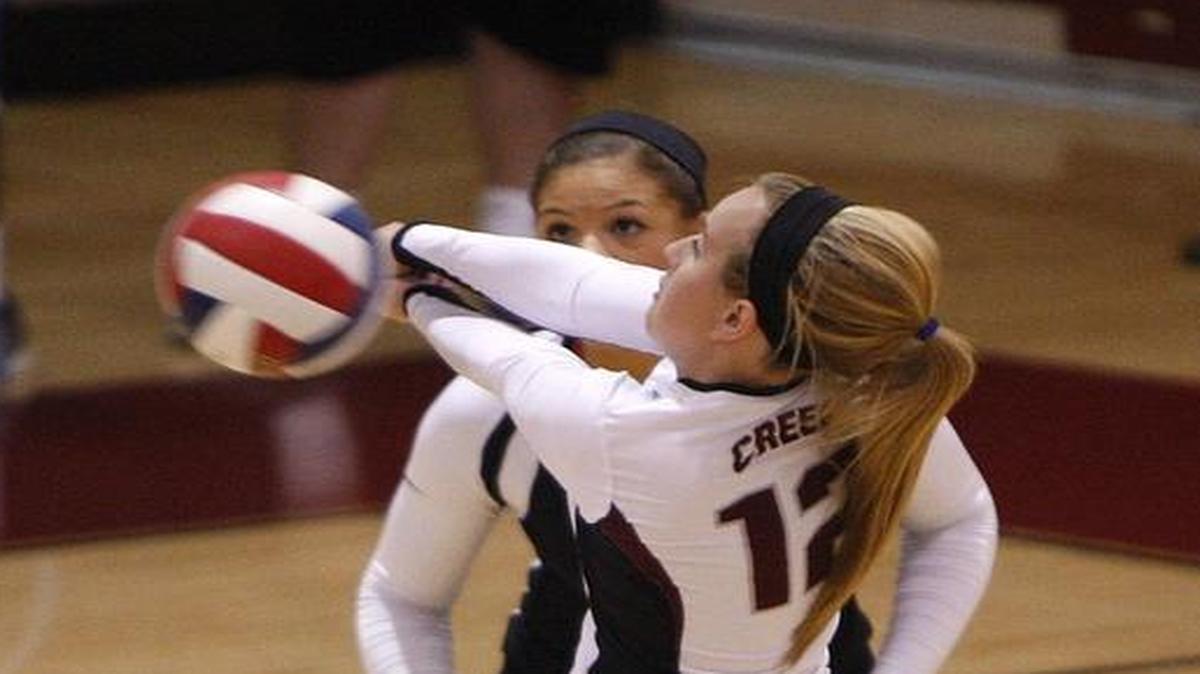 Tates Creek libero Macy Reihing sets the ball against Dunbar in the Nolan Barger Gymnasium in Lexington, Ky., Thursday, September 24, 2015.