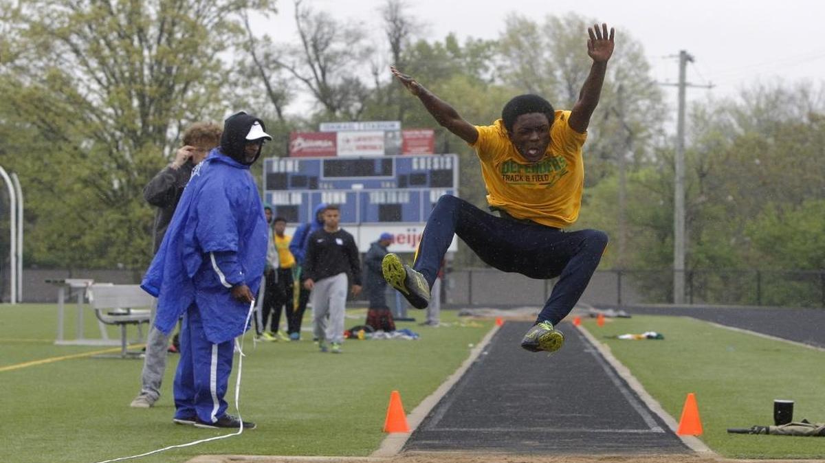 Bryan Station's Moses Botaka extends in the long jump but ended a half-inch short in second place at the Tyson Gay Invitational and Trinity Gay Memorial track meet at Ishmael Stadium in Lexington on Saturday.