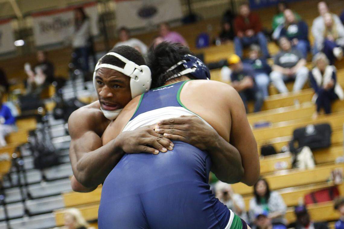 Bryan Station’s Jahvon Frazier, left, battled Great Crossing’s Joaquin Solis for the 215 class title at the Region 6 Championships at Frederick Douglass High School on Saturday.