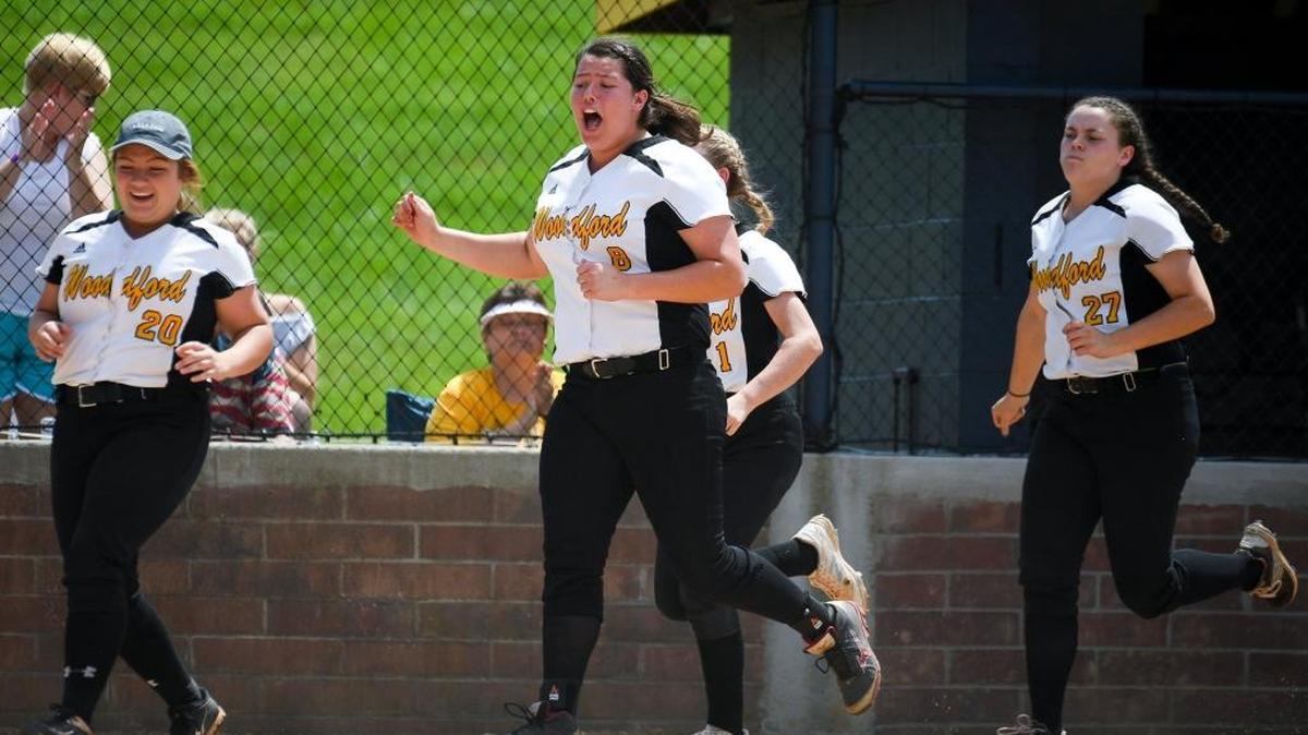 Woodford County’s Caitlin Karo (8) and her teammates celebrated after a grand slam by Kelsey Coleman against Tates Creek.