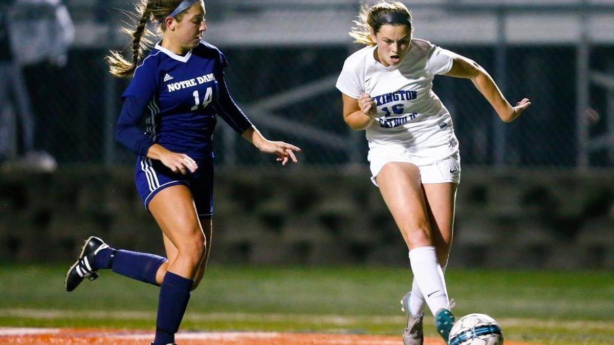 Lexington Catholic's Kennedy Tranter (16) scores a goal past Notre Dame's Jenna Woods (14) during their 11th Region semi-state game at Lexington Catholic in Lexington, Ky., Tuesday, Oct. 24, 2017. Notre Dame beat Lexington Catholic 4-1.