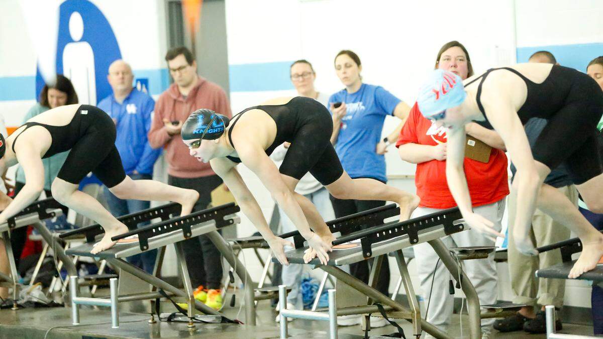 Lexington Catholic’s Mia Jones, center, alongside Lafayette’s Riley Shaw, started a bit behind her competitors in the 200-yard individual medley, but was able to set a record time at the Region 8 Swimming and Diving Championships at Stivers Aquatic Center in Barbourville on Saturday.