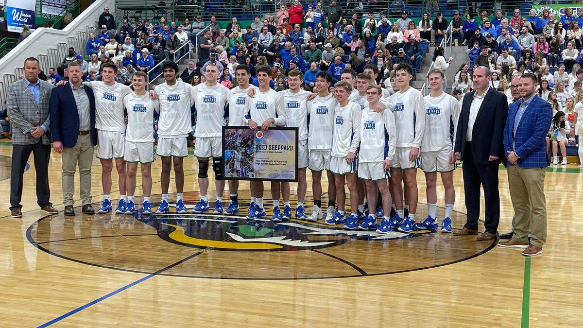 North Laurel’s Reed Sheppard, center, poses with his team as the Jaguars celebrate Sheppard’s selection to the 2023 McDonald’s All-American team on Friday night.