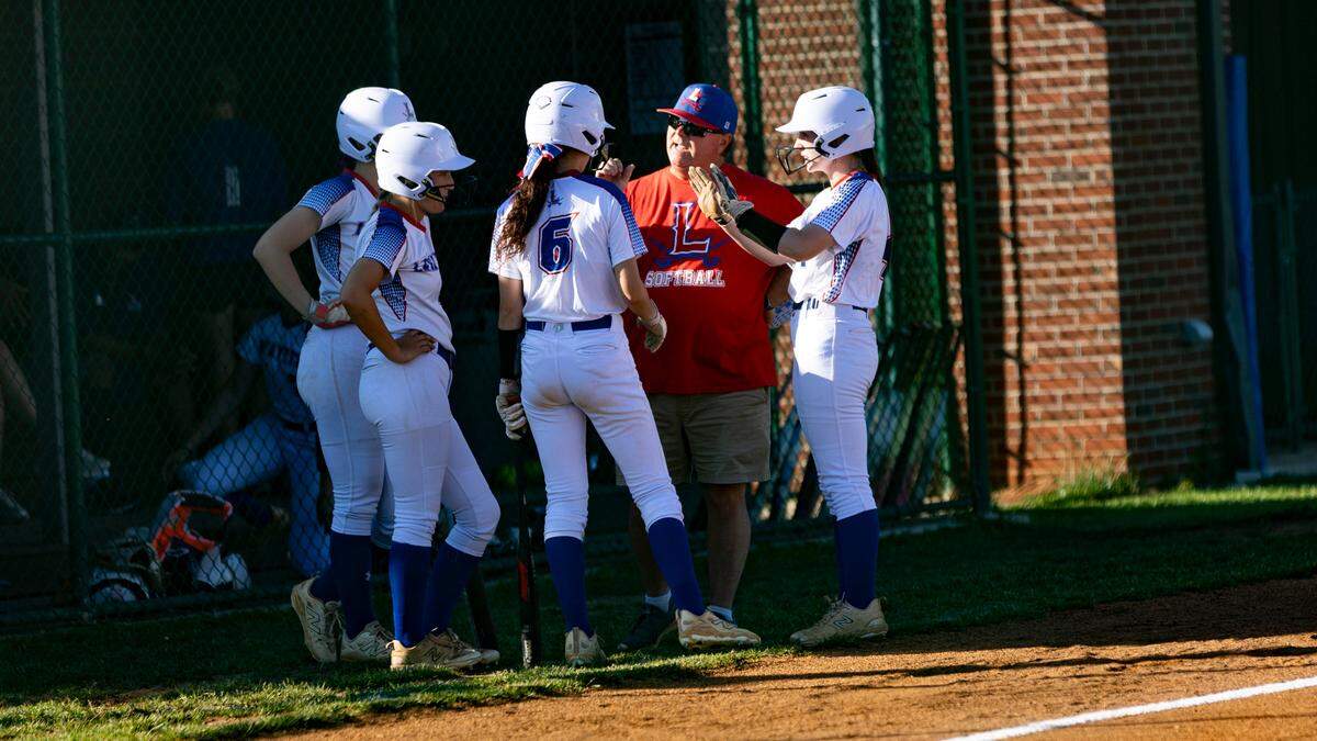 Lafayette head coach Chris Hould delivers instructions to hitter Skylar Davis (6) and some of her teammates during a Franklin County timeout at Lafayette High School on Wednesday.