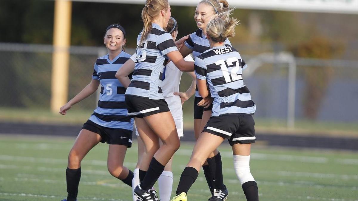 West Jessamine's Anna Lee, third from left, is congratulated by teammates after scoring a goal against Lexington Catholic in the KHSAA girls' state soccer championship at R. L. Grider Stadium in Lexington, Ky., Saturday, November 5, 2016. Photo by Matt Goins
