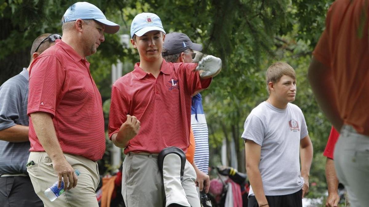 Golfer Henry Lane chats with Lafayette boys’ golf head coach Todd Reynolds during the Five-Star General Invitational on the Gay Brewer Jr. Course at Picadome in Lexington, Ky., Friday, July 28, 2017.