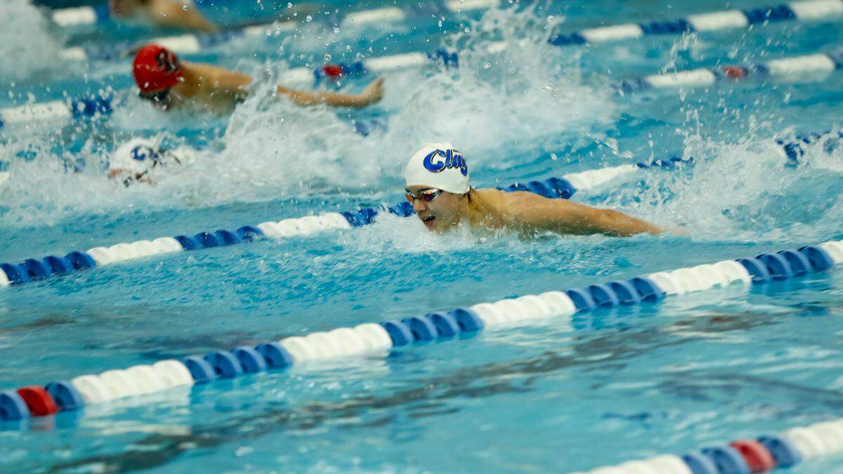 Henry Clay’s Jack Liau, right, finished just ahead of teammate Hayes Doolin in the 100-yard butterfly at the Region 8 Swimming and Diving Championships at Stivers Aquatic Center in Barbourville on Saturday.
