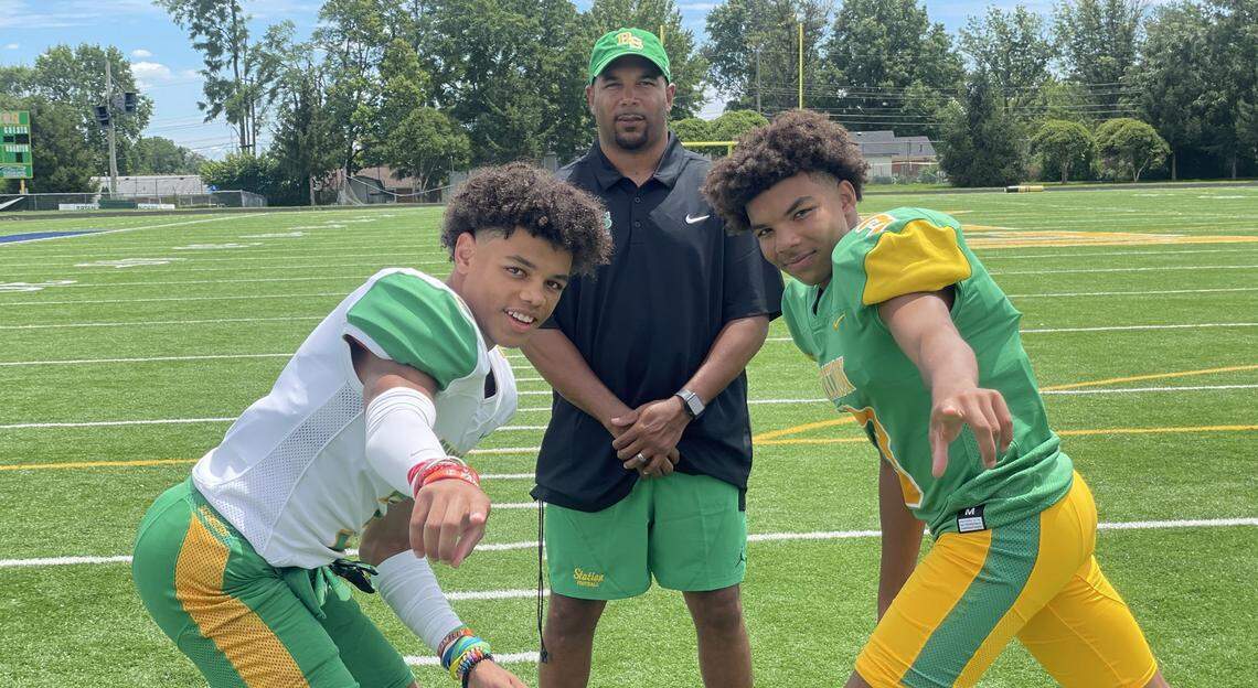 J.T. Haskins Sr., center, posed with his sons, J.T. Haskins Jr., left, and Jordan Haskins, at Bryan Station High School ahead of the 2023 football season. All three are two-time Herald-Leader preseason player honorees.