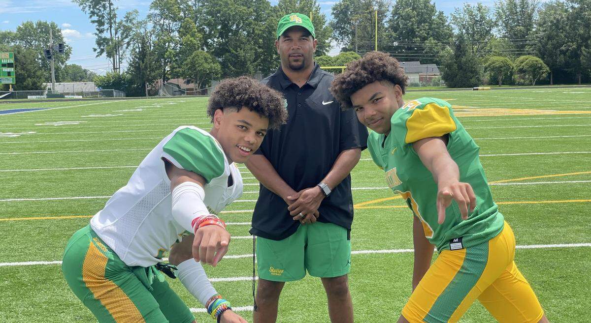 J.T. Haskins Sr., center, posed with his sons, J.T. Haskins Jr., left, and Jordan Haskins, at Bryan Station High School ahead of the 2023 football season.