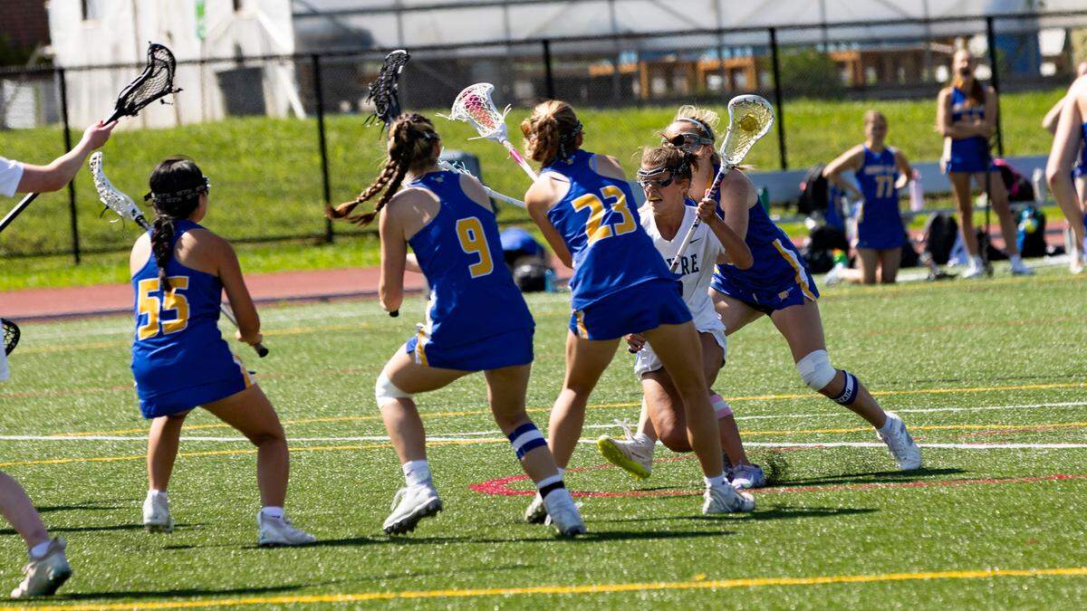 Sayre’s Anna Mullikin, in white, tries to advance through several Henry Clay defenders during the Spartans’ 15-8 win at Transylvania University’s Pat Deacon Stadium in the state tournament quarterfinals on Saturday.