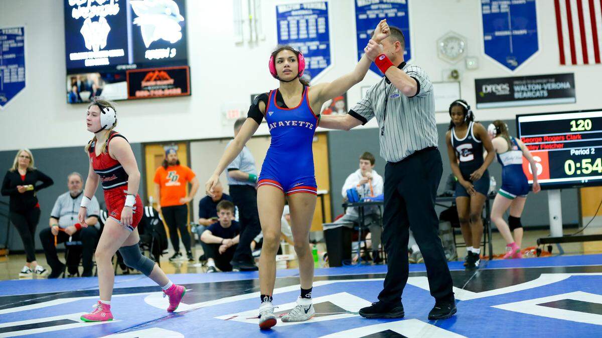 Lafayette’s Aaliyah Davis has her armed raised in victory after defeating George Rogers Clark’s Bailey Fletcher in the 120 division of the Girls Region 8 Wrestling Championships at Walton-Verona High School in Walton on Saturday.