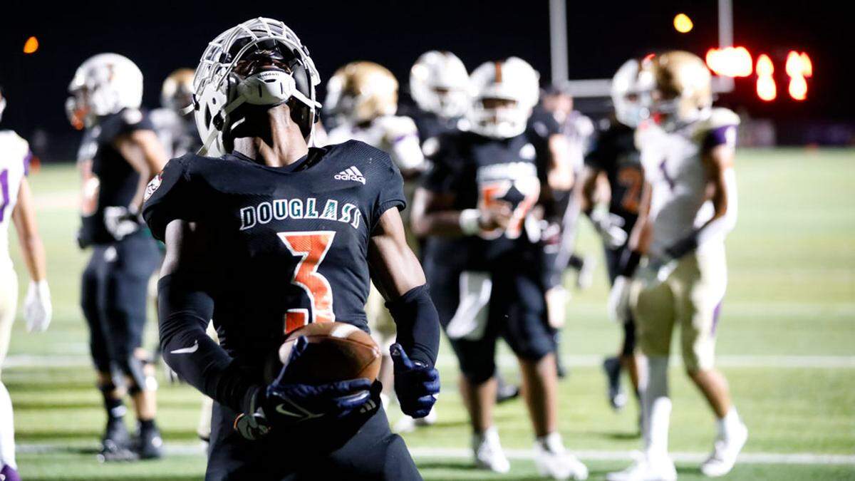 Frederick Douglass running back Pharo Watts celebrated an 8-yard touchdown run in the first half of the Broncos’ game against Male at The Farm in Lexington on Friday, Oct. 4, 2024.