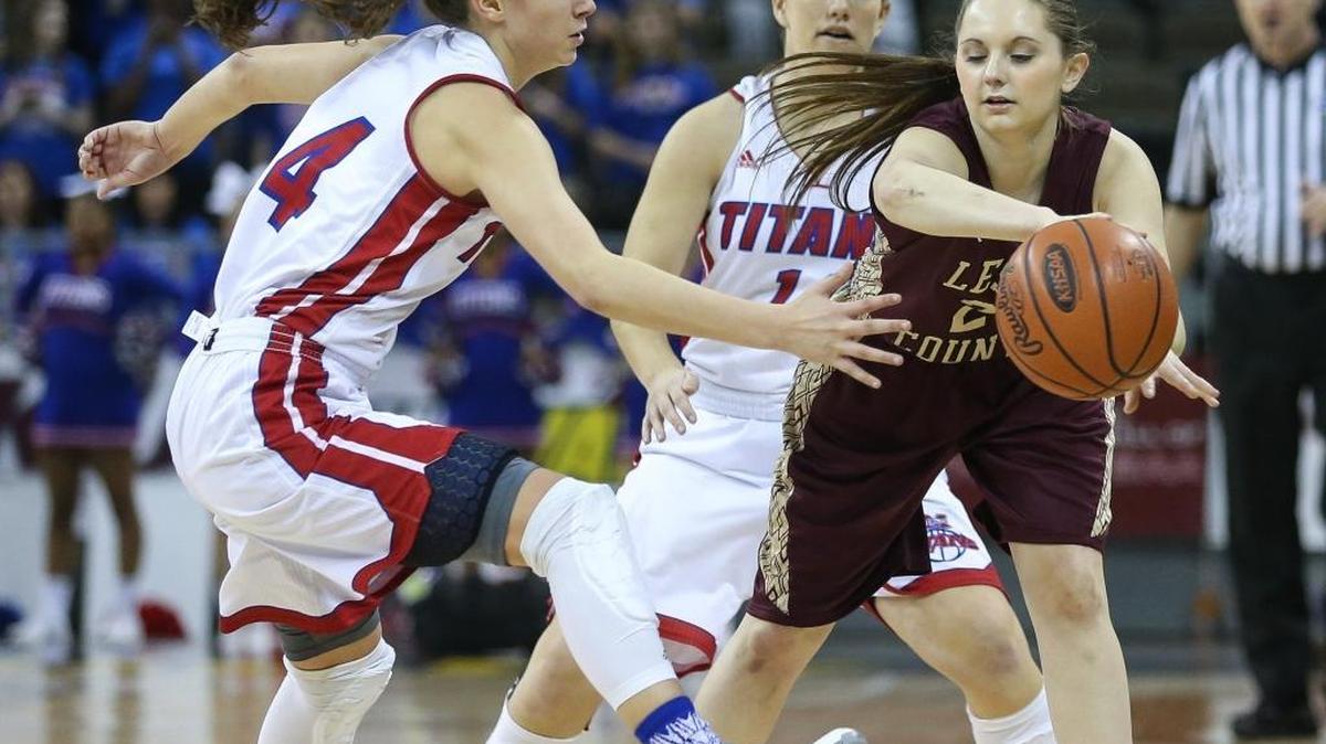 Mercer County’s Seygan Robins, pressures Leslie County’s Emily Griffith during the first quarter of their opening game in the 2016 St. Elizabeth Healthcare/KHSAA Girls’ Sweet 16 State Tournament, Wednesday, March 9, 2016. Mercer’s Madeline Bartley is in the background.