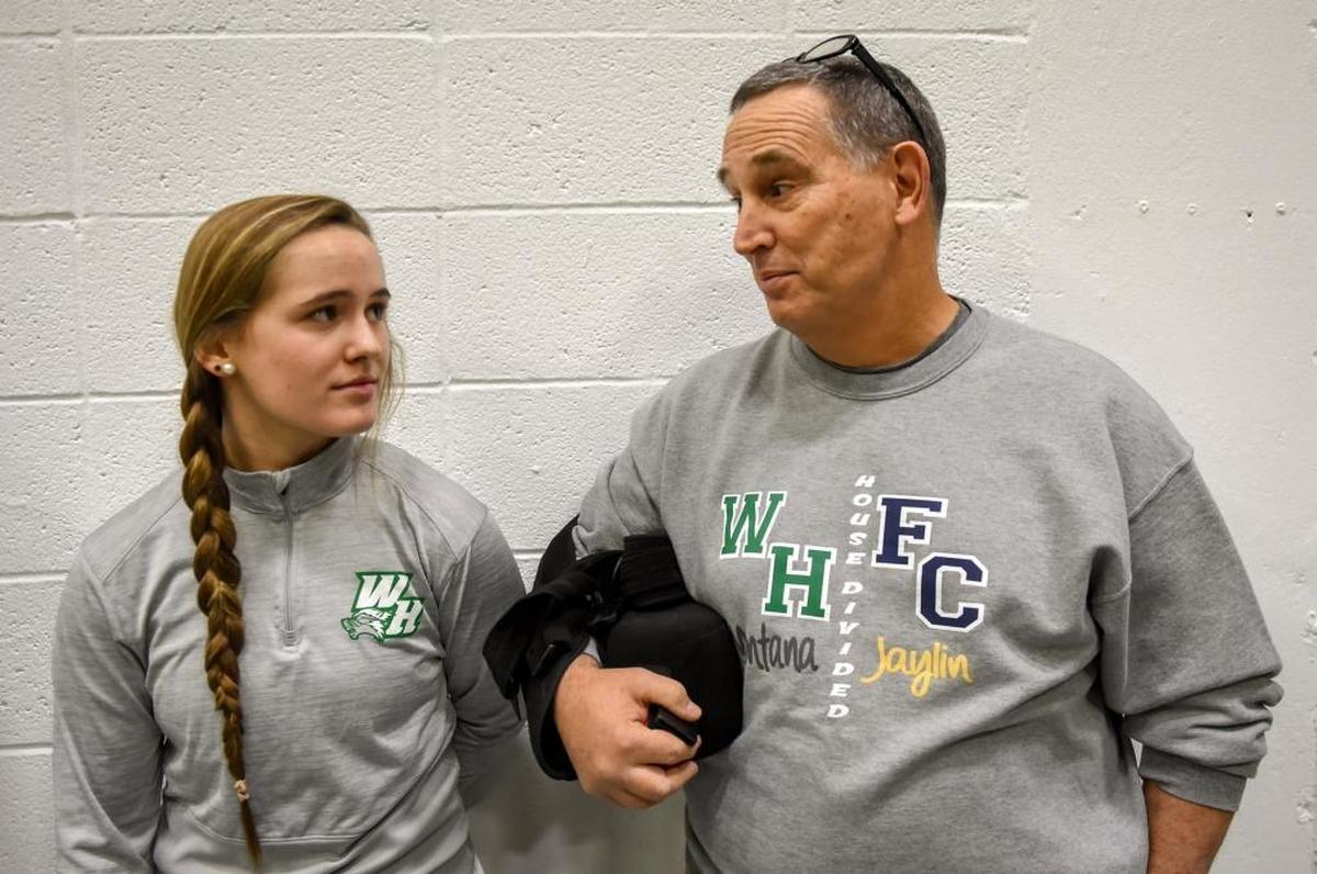 Montana Muravchick talks with her father, Gregg, before the start of the basketball game against Franklin County.